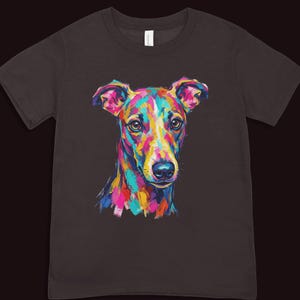 A dark brown short-sleeved t-shirt centered with a vibrant multi-colored pop art graphic of a dog head.