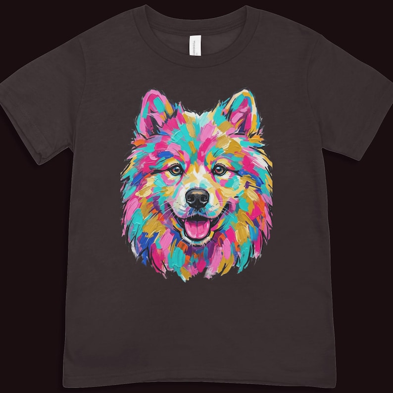 A dark brown short-sleeved t-shirt printed with a vibrant pop art illustration of a smiling fluffy puppy.