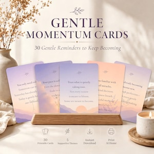 May include: A set of 30 Gentle Momentum Cards featuring soft pastel gradients and inspirational text. The cards are displayed in a wooden stand, with the title GENTLE MOMENTUM CARDS and 30 Gentle Reminders to Keep Becoming printed above. Icons indicate 30 printable cards, 5 supportive themes, instant download, and print at home options.