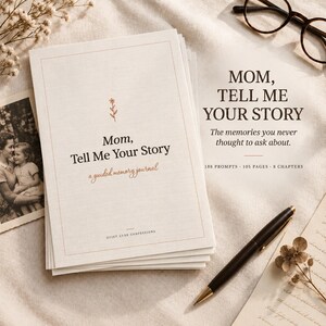 May include: A stack of cream-coloured guided memory journals titled Mom, Tell Me Your Story with a small flower icon. The cover includes the text a guided memory journal and Quiet Luxe Confessions. A black pen and spectacles are placed nearby.