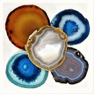 May include: Five agate slices in various colours and patterns, including blue, brown, grey, and white. The slices are arranged in a circular pattern.