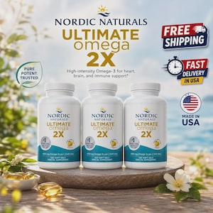 May include: Three white plastic bottles of Nordic Naturals Ultimate Omega 2X fish oil supplement. Each bottle features a label with blue and gold text, stating 1280 mg Omega-3s per 2 soft gels and 120 soft gels. Loose yellow soft gels sit nearby.