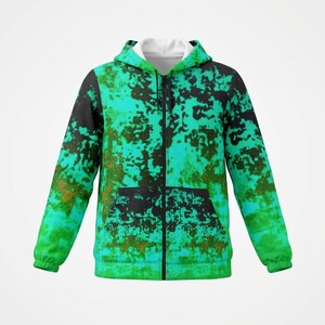 May include: A full-zip hoodie with a unique abstract pattern. The design features a blend of teal, black, and brown colors, creating a textured, mottled appearance. The hoodie has a white interior lining and a front pocket.