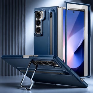 May include: A navy blue phone case with a built-in stand and a camera module. The case is designed to fit a foldable phone, with a protective cover for the screen. The stand is silver and allows the phone to be propped up.