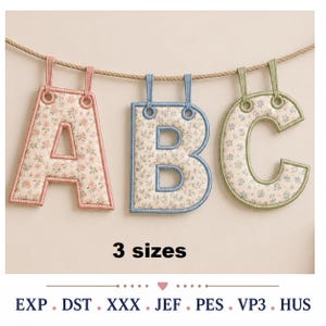 May include: Three fabric letters A, B, and C hanging from a rope. Each letter features a floral pattern and a coloured border. The text 3 sizes is displayed below, followed by the file formats EXP, DST, XXX, JEF, PES, VP3, and HUS.