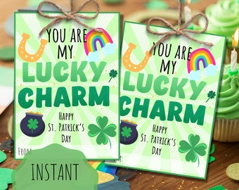 May include: Two printable St. Patrick's Day gift tags with a green shamrock, pot of gold, rainbow, and horseshoe design. The text on the tags reads "You are my lucky charm. Happy St. Patrick's Day."