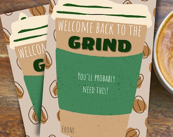 May include: Two coffee-themed gift cards with the text "WELCOME BACK TO THE GRIND" and "You'll probably need this!" on a light brown background with coffee bean illustrations. The cards have a green coffee cup sleeve and a white lid.
