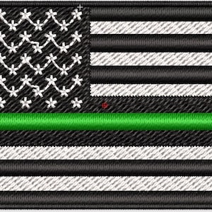 May include: Embroidered patch featuring a stylized American flag design. The flag has a black and white color scheme with a green stripe and white floral-like stars. The stripes alternate between black and white.