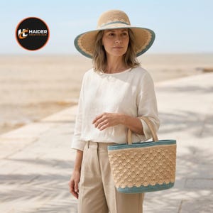 May include: A wide-brimmed straw hat with a teal band and a matching woven tote bag featuring a scalloped pattern and teal trim. The hat has a rounded crown and a wide brim, while the tote bag has two sturdy handles and a structured rectangular base.