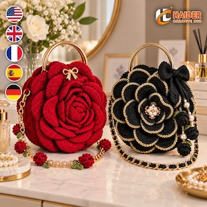 May include: Two round crochet handbags shaped like blooming flowers. One bag is deep red with a small gold bow, and the other is black with gold-trimmed petals, a black bow, and pearl accents. Both feature gold metal circular handles and chains.