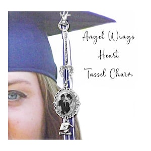 May include: A silver tassel charm with angel wings, a heart, and a photo of a couple. The charm is attached to a blue and white graduation tassel. "Angel Wings Heart Tassel Charm" is written in black text.
