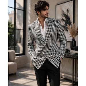 Men’s black and white houndstooth blazer back view with tailored fit, long sleeves and structured design in modern indoor setting