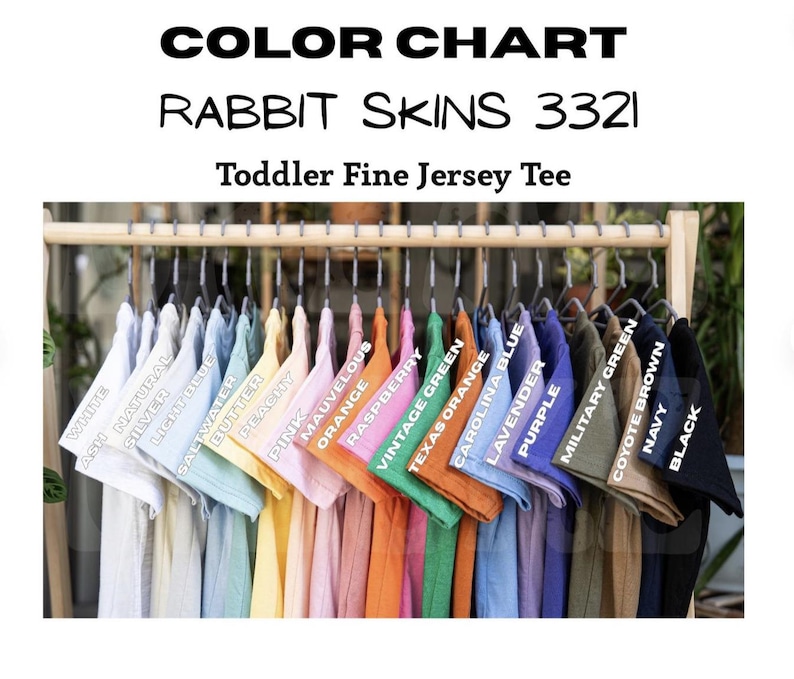 May include: A color chart for Rabbit Skins 3321 toddler fine jersey tees. The chart displays a variety of colors, including white, ash, silver, light blue, saltwater, butter, peachy, pink, orange, mauve, raspberry, vintage green, and more.