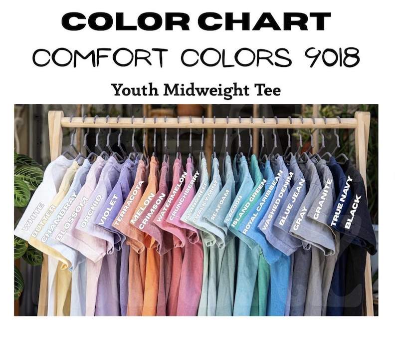 May include: A color chart of Youth Midweight Tees in various colors, including white, butter, and black. The shirts are displayed on hangers, showcasing the range of available hues. The text "COLOR CHART" and "COMFORT COLORS 9018" are visible.