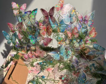 Libro pop-up 3D a forma di farfalla, realizzato a mano.