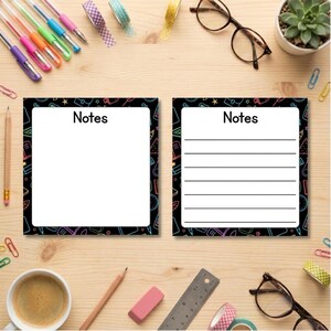 May include: Two square note pads with a black border featuring colourful school supply icons. The left pad has a blank white centre with the word Notes at the top. The right pad has a white centre with horizontal lines and the word Notes at the top.