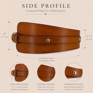 May include: A tan brown wide waist belt featuring a contoured shape that tapers toward the center. The belt includes a gold-toned metal buckle, gold-toned studs, and visible stitching. Dimensions are 3 inches at the side and 2.25 inches at the center.