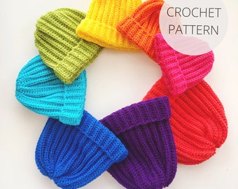 May include: A rainbow of crocheted hats in various colors, including yellow, green, blue, purple, and red. The hats are arranged in a circle on a white background. CROCHET PATTERN is written in white text on a white circle.