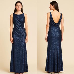 May include: A navy blue sequined formal gown. The sleeveless dress features a draped bodice and a floor-length skirt. The back of the dress has a cowl neckline. The dress is shown from the front and back.
