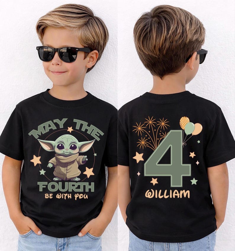 May include: Black t-shirt with a green alien graphic and the text "MAY THE FOURTH BE WITH YOU." The back of the shirt shows a large number "4", the name "WILLIAM", and celebratory graphics. The t-shirt is designed for a child.