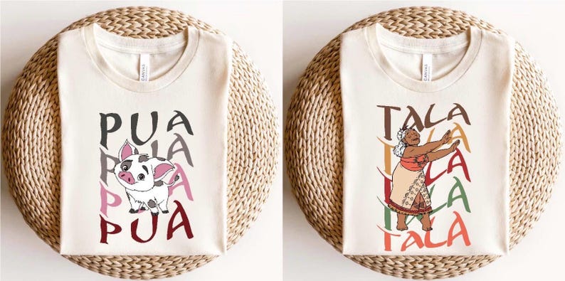 May include: Two cream-colored t-shirts with graphic designs. One features a cartoon pig with the word "PUA" in gray, pink, and maroon. The other shirt displays a woman dancing with the word "TALA" in brown, yellow, green, and maroon.