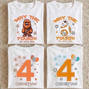 May include: Four white t-shirts with orange and grey graphics. Two shirts say "May the Fourth be with you" with Star Wars characters. The other two shirts have the number "4" and the name "Christian".