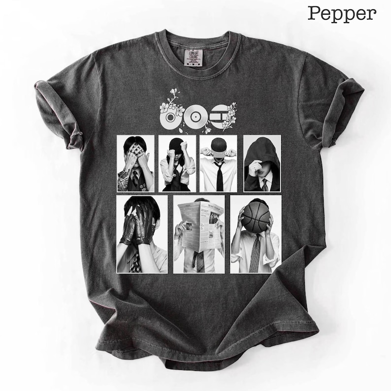 May include: Dark gray t-shirt with a graphic design featuring a collage of black and white images of people covering their faces. The word "Pepper" is printed in the upper right corner.