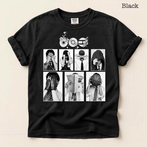 May include: Black t-shirt with a graphic design featuring a series of black and white images of people covering their faces. The word "Black" is printed at the top right.