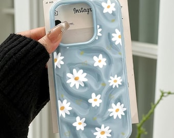 Funda para iPhone con diseño de corazón ondulado: Cubierta antigolpes con estampado floral de margaritas en tonos pastel.
