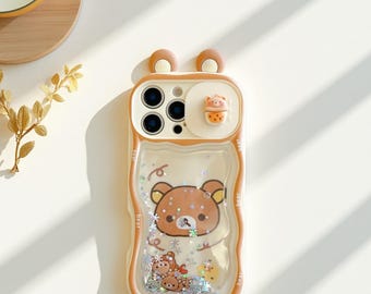 Funda para iPhone de Rilakkuma con diseño de arenas movedizas, orejas de oso y tapa deslizante para la cámara.