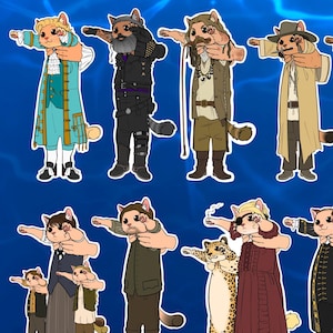 May include: A set of 18 vinyl stickers featuring cats dressed in various outfits, including pirate, sailor, and historical figures. The stickers are part of a "Our Flag Means Cats" collection and are available in a "Buy 2 Get 1 Free" offer. A free secret kitty sticker is included with every full sticker set purchase.