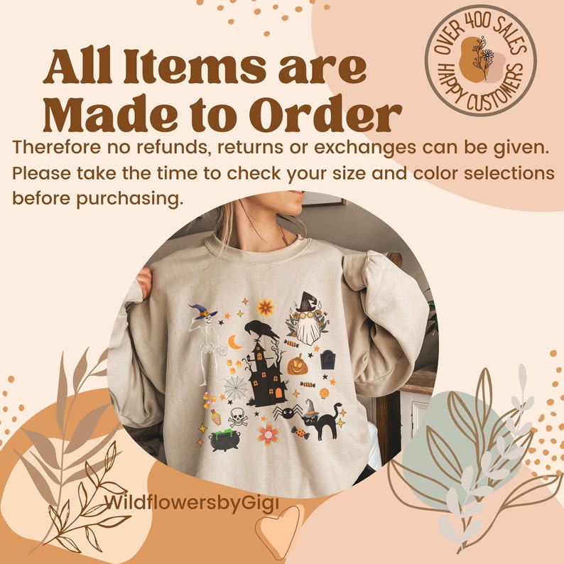 May include: Beige sweatshirt with a colorful Halloween-themed graphic. The design includes a haunted house, a black cat, a witch, a skeleton, and other spooky elements. Text on the image reads "All Items are Made to Order" and "Over 400 Sales Happy Customers".