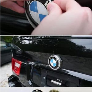 May include: A black car with a BMW emblem being installed. The emblem is a circular badge with a blue and white design. The text "E53 REAR EMBLEM" is at the bottom of the image.