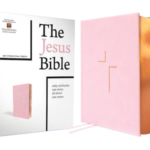 May include: The Jesus Bible in a pink cover with gold-colored edges, and a matching box. The box has the text "The Jesus Bible" in black and pink, along with "sixty-six books. one story. all about one name."