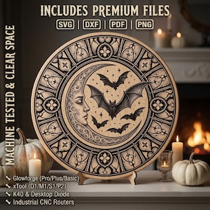 May include: A circular wooden plaque featuring a laser-engraved design of a crescent moon with a human face profile, surrounded by several bats and intricate gothic-style patterns. The text INCLUDES PREMIUM FILES SVG DXF PDF PNG is visible.