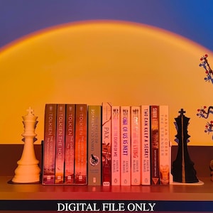 May include: A shelf displays a collection of books, including titles by Tolkien and Harlan Coben, alongside chess pieces and a decorative floral arrangement. The text "DIGITAL FILE ONLY" is at the bottom.