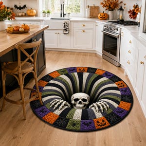May include: A round area rug featuring a 3D optical illusion of a black and white striped vortex with a human skull and skeletal hands emerging from the center, surrounded by a border of orange, green, and purple squares with Halloween motifs.