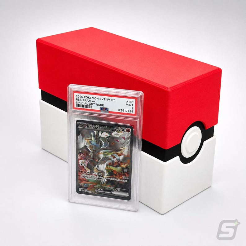 May include: A PSA graded 2025 Pokemon SV11W CT Reshiram ex Special Art Rare trading card in a clear plastic slab, positioned in front of a rectangular storage box designed with red, white, and black colors resembling a classic Poke Ball.