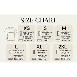 May include: A size chart for t-shirts, with measurements in inches. The chart includes sizes XS, S, M, L, XL, and 2XL, with body length and chest width measurements for each size. The text "SIZE CHART" is at the top.