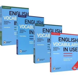 May include: Four English vocabulary books in a stack. The books are blue with white text and the title "English Vocabulary in Use". The books are labeled "Third Edition", "Fourth Edition", and "Elementary".