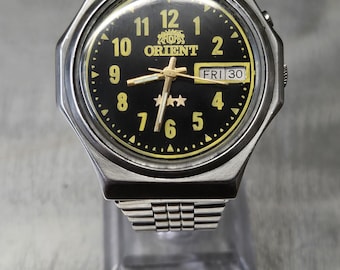 Orient automatic watch with refinished dial