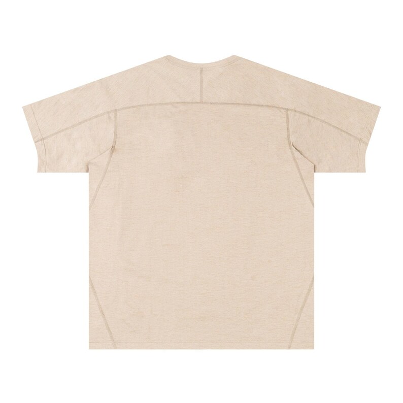May include: A beige short-sleeved t-shirt with visible stitching details. The shirt has a crew neck and a relaxed fit. The seams are reinforced with a contrasting thread, adding a subtle design element. The fabric appears to be a lightweight material.
