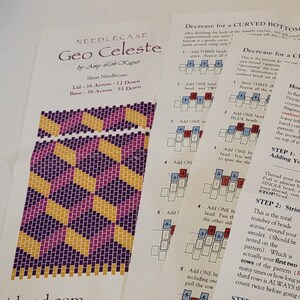May include: A close-up of a beading pattern with instructions for a needlecase called "Geo Celeste" by Amy Loh Kuper. The pattern is made with purple, yellow, and pink beads. The instructions include a diagram of the beading pattern and a description of the steps involved.