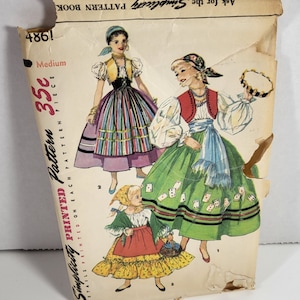 May include: Vintage Simplicity sewing pattern for a three-piece costume. The pattern includes a red, green, and yellow skirt with a white blouse and a vest. The pattern is for sizes medium and includes instructions for sewing the costume.