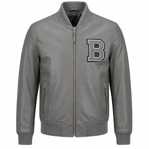 May include: A grey bomber jacket featuring a central zip closure, ribbed collar, cuffs, and hem. The jacket has two zipped side pockets and a large, dark grey letter B patch with a light grey border stitched onto the upper left chest area.