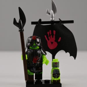 May include: A set of three ceramic mugs with a speckled, matte finish. The mugs are in shades of cream, light gray, and dark gray. Each mug has a simple, minimalist design, perfect for coffee or tea.