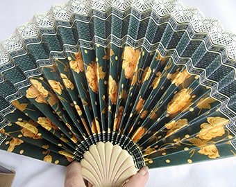 Decorative folded paper fireplace fan