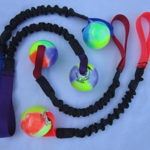 Brinquedo de puxar com bungee e bola de hóquei de rua
