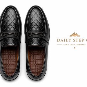May include: A pair of black loafers featuring a quilted diamond pattern on the upper, a black metal bit detail across the vamp, and a brown grid-textured insole. The text DAILY STEP CO STEP INTO COMFORT is displayed to the right of the shoes.
