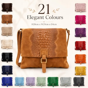 May include: A suede crossbody bag with a central crocodile-embossed panel and a front flap closure featuring a gold-tone buckle. The bag measures H28cm x W29cm x D4cm. The image displays 21 colour variations of this bag, with the text 21 Elegant Colours.